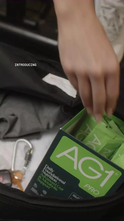 AG1 Facebook ad - travel pack packed into a duffel product announcement