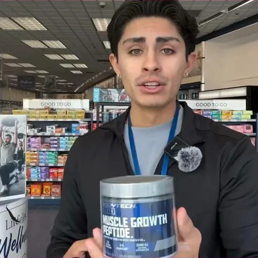 The Vitamin Shoppe Facebook ad - store employee reviewing a private label product